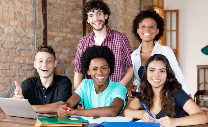 Portait of international students looking at camera at university