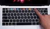 Apple 15in MacBook Pro, Retina, Touch Bar, 2.9GHz Intel Core i7 Quad Core, 16GB RAM, 512GB SSD, Silver, MPTV2LL/A